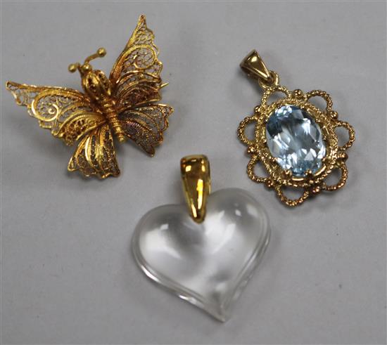 A yellow metal-mounted aquamarine pendant, a Lalique pendant and a filigree `butterfly` brooch.